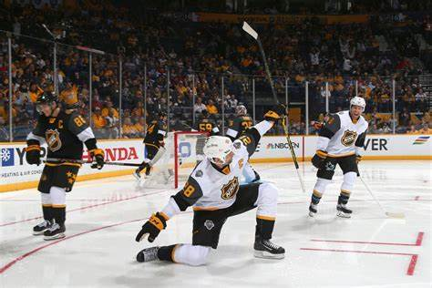 Hockey, the player rejoices at the scored goal