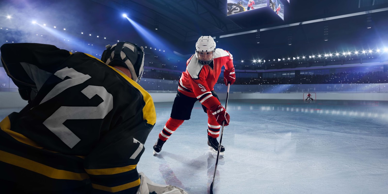 two hockey players at the skating rink