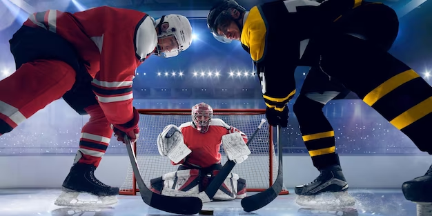 Three guys playing hockey